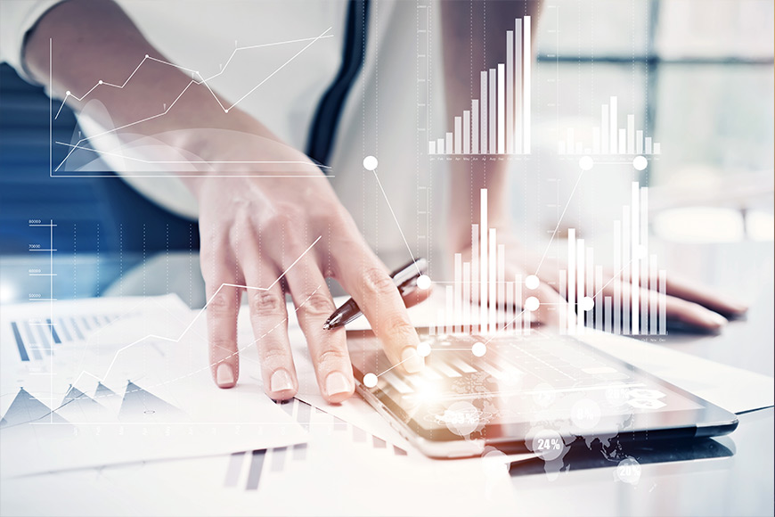 Person analyzing data on a tablet with overlaid graphs and charts.