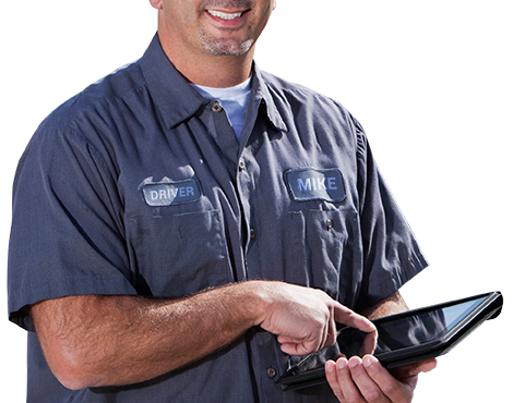 Smiling technician using a tablet in work uniform.